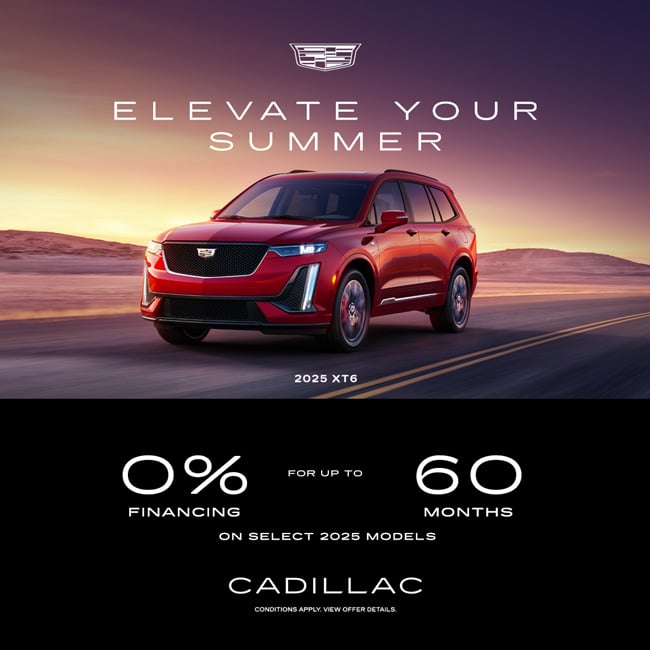 Red 2025 Cadillac XT6 on a desert road at sunset, featuring 0% financing for 60 months offer.